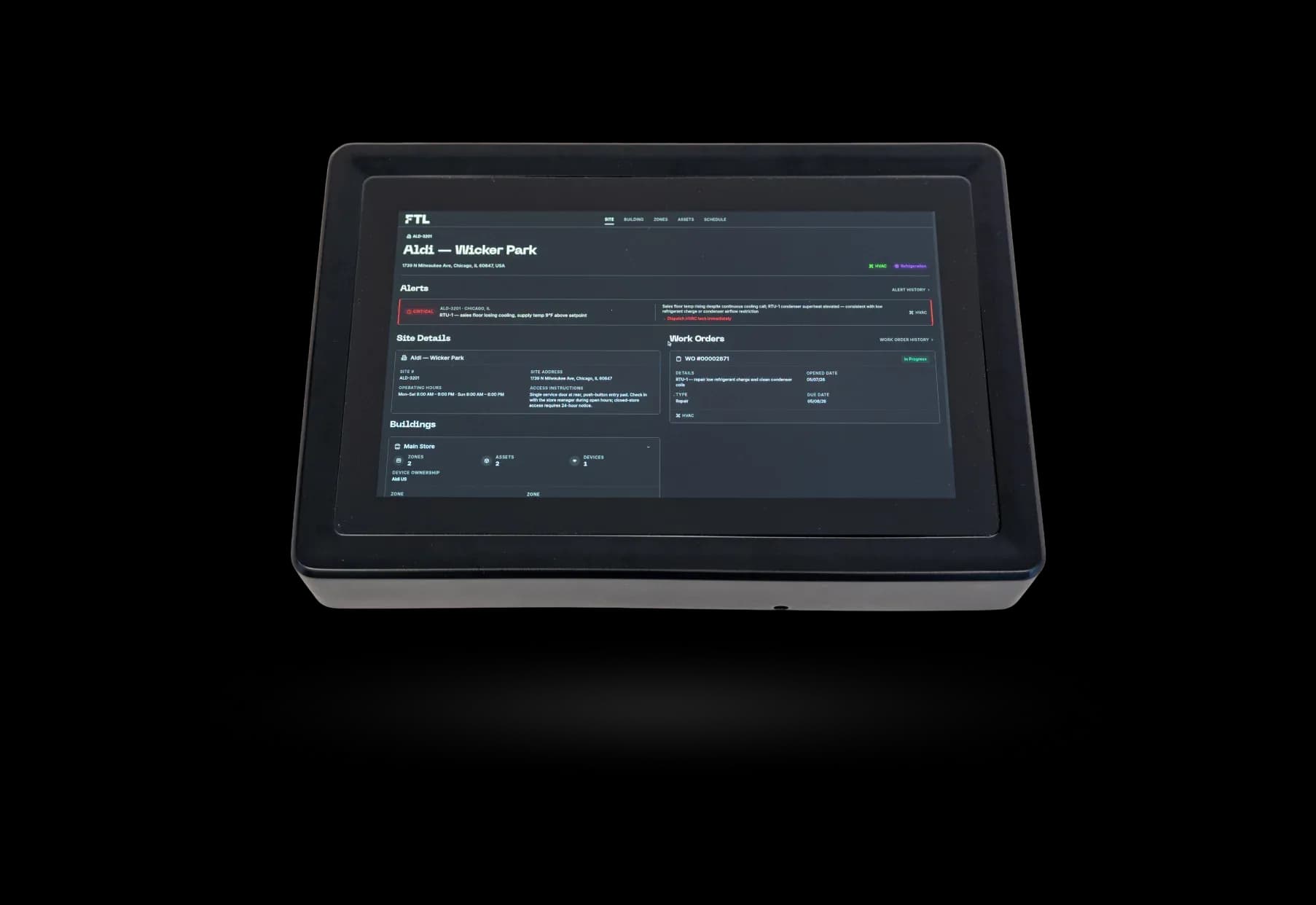 FTL touchscreen control panel displaying a facility dashboard with site information, alerts, work orders, and building management controls.
