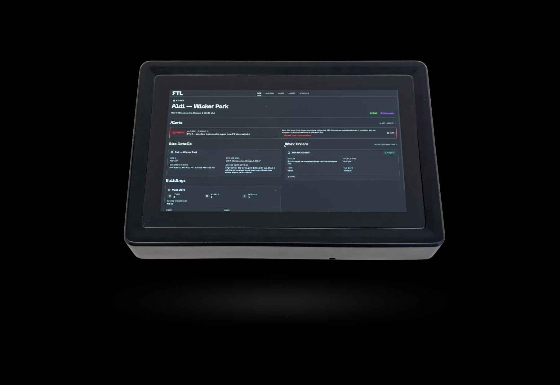 FTL touchscreen control panel displaying a facility dashboard with site information, alerts, work orders, and building management controls.