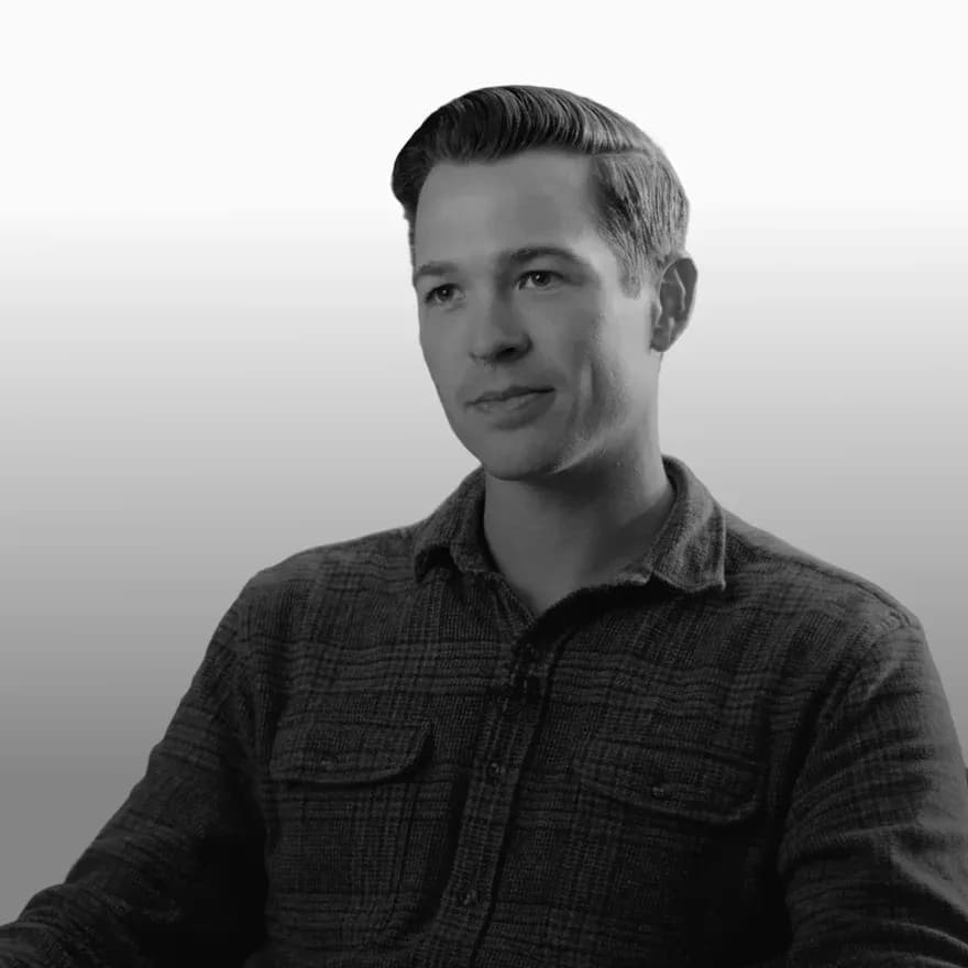 Black-and-white portrait of FTL President and Co-Founder Clayton Callander, a commercial building technology leader focused on facilities triage, HVAC innovation, and intelligent building operations.